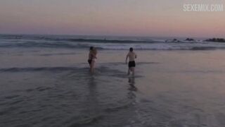 Scarlett Davies in White bikini on the beach, scene in #FollowMe